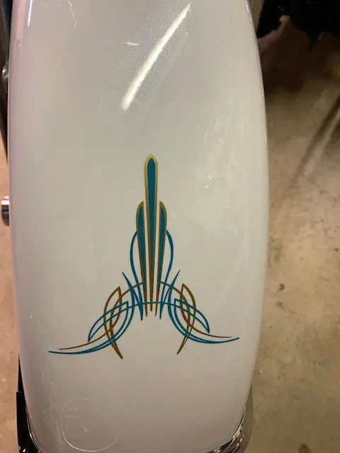 A surfboard with a design on it.