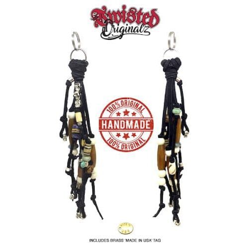 A pair of black leather guitar straps hanging from the back of a bag.