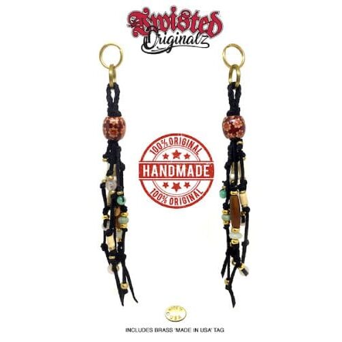 A pair of earrings with beads and leather.