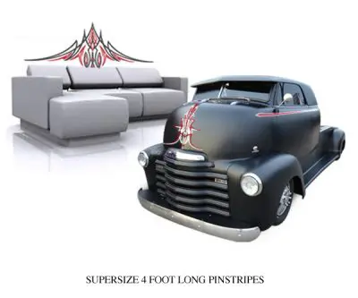 A black truck sitting in front of a couch.